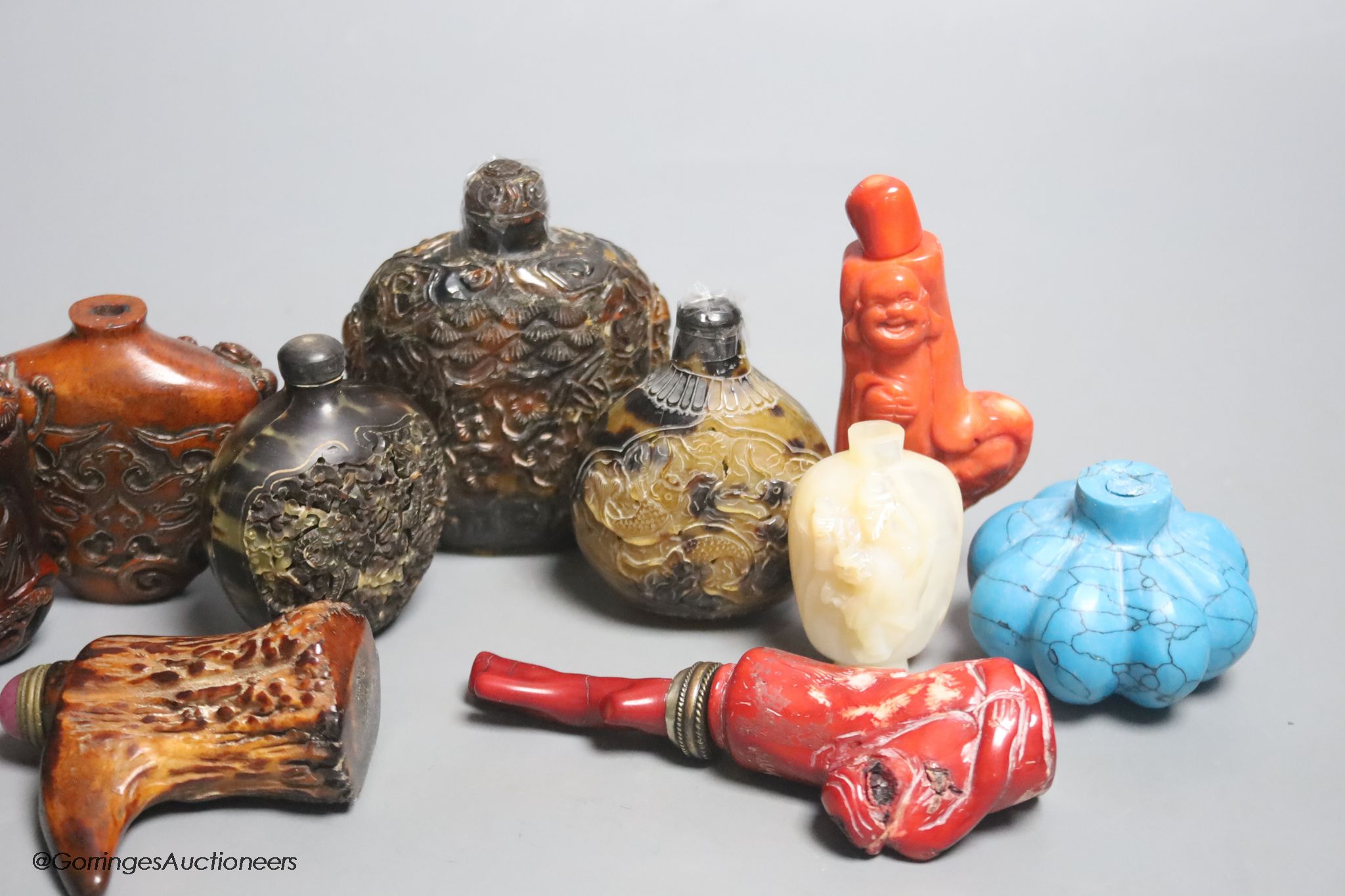 A collection of Chinese eleven horn and mother of pearl snuff bottles